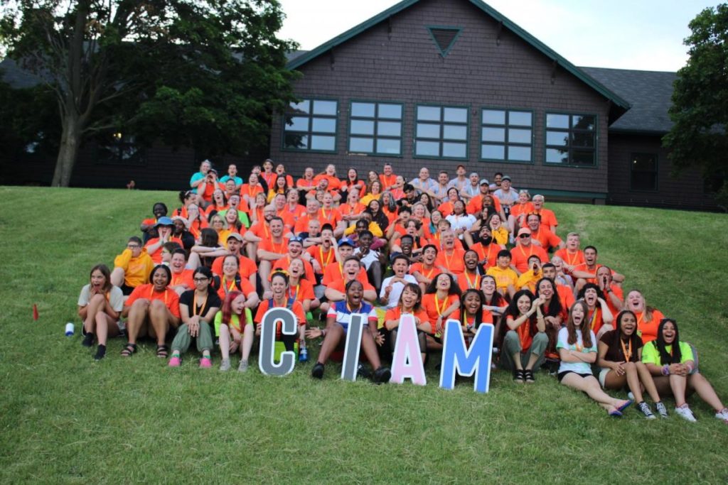 Large group photo of campers on a lawn
