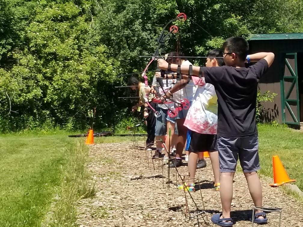 Campers learning archery