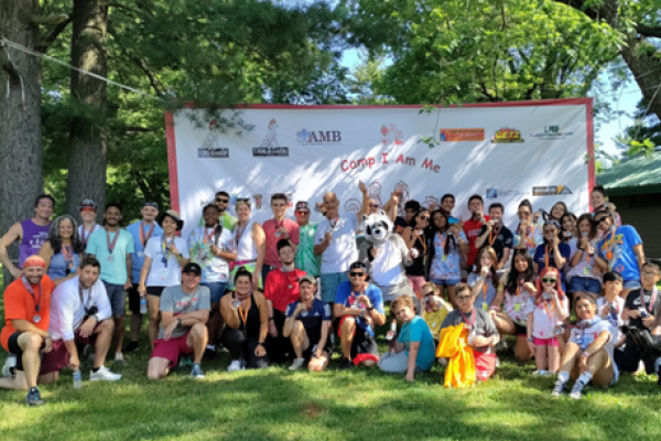 Large outdoor group photo of the staff and volunteers of Camp I Am Me