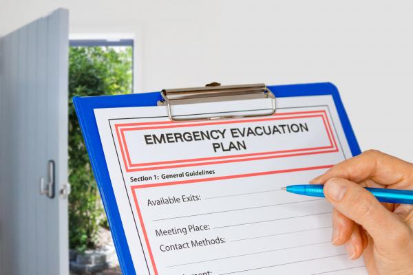 Person reviews an Emergency Evacuation Plan document