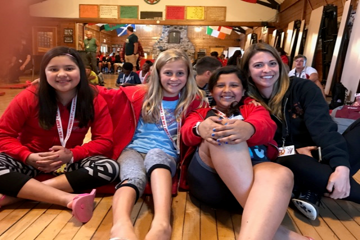 Four girls posing for a picture at fundraising campaign